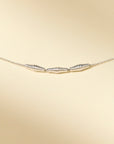 Close-up of silver croissant necklace – timeless and easy-to-wear with signature clasp